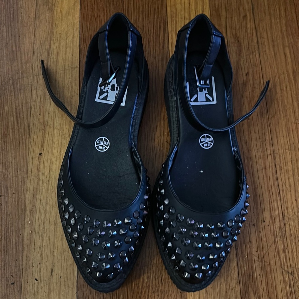 Black T.U.K. platform creepers with silver studded front embellishments. Size 8